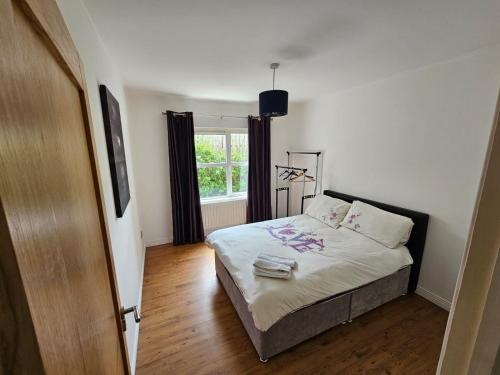 a bedroom with a bed and a window at Letterkenny View in Letterkenny