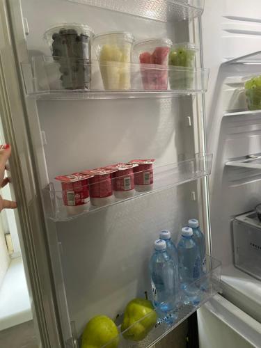 an open refrigerator filled with lots of food and drinks at Fly Apart in (( Turksib ))