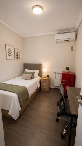 a bedroom with a bed and a desk and a chair at ELAN LEVEL Parla in Parla