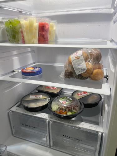 an open refrigerator filled with food and vegetables at Fly Apart in (( Turksib ))