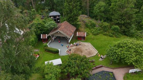 an overhead view of a house with a playground at Vaicay Garden Resort in Arendal