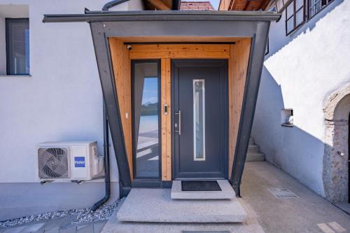 an entrance to a house with a wooden door at Sten House in Škofja Loka