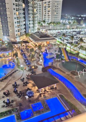 an aerial view of a water park at night at Beach Gav Resort in Ilha de Atalaia
