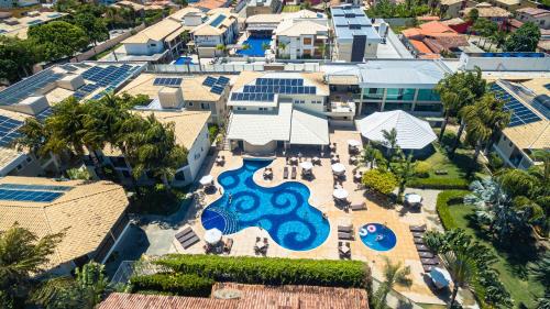 an aerial view of a resort with a pool at Vitoria Regia Praia Hotel in Porto Seguro