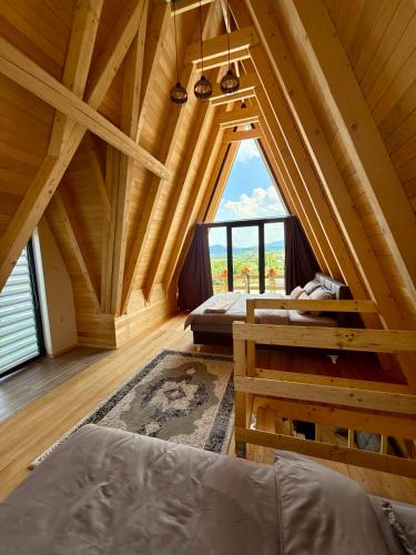a room with a large window in a log cabin at Villa Kovacevic 2 in Bihać