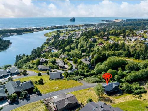 an aerial view of a town with a river and houses at Alta Vista in Pacific City