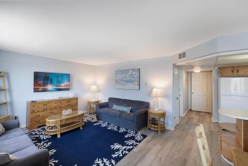 a living room with a couch and a table at Astronaut Motel in Wildwood Crest