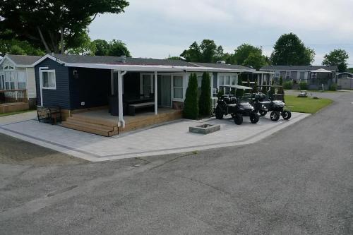 two motorcycles parked in front of a house at Sherkston Shores Cottage in Port Colborne