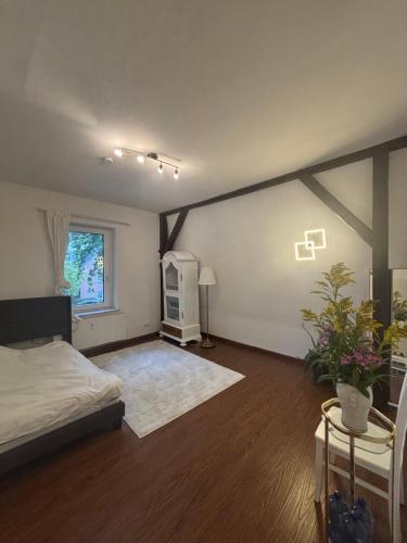 a large room with a bed and a window at Gästehaus in Kronshagen