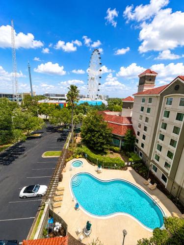 a view of a swimming pool in a parking lot at La Quinta by Wyndham Orlando I Drive/Conv Center in Orlando