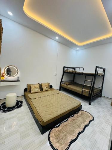 a bedroom with two bunk beds in a room at N&N Family in Ngân Hà