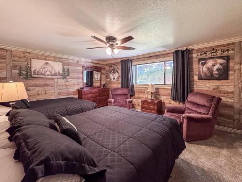a bedroom with two beds and a ceiling fan at Bear Lake Ranch with Bear Lake Access in Garden City