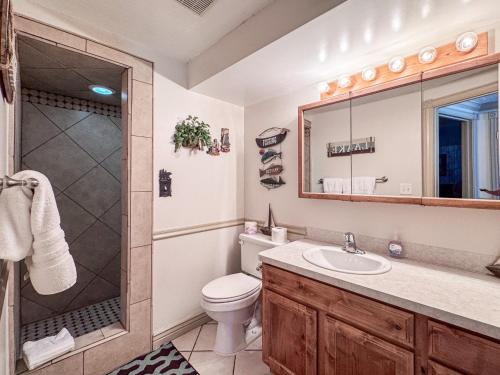 a bathroom with a toilet and a shower and a sink at Bear Lake Ranch with Bear Lake Access in Garden City