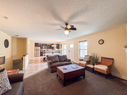 a living room with a couch and a table at Bear Lake Bungalow in Garden City