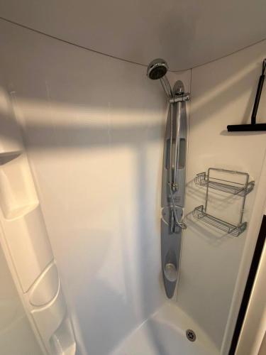 a bathroom with a shower and a sink at Sandytoes and Seaside smiles in Wyke Regis