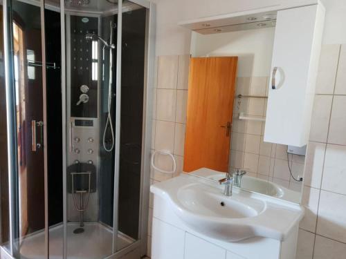 a bathroom with a sink and a shower at Karawankenpanorama S in Liebenfels
