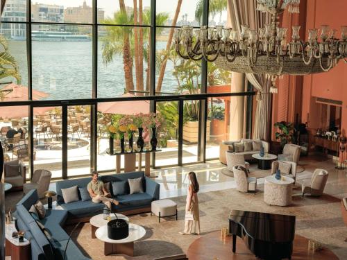 a rendering of a lobby with a view of the water at Sofitel Cairo Nile El Gezirah in Cairo