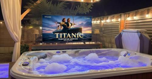 a tub filled with ice in front of a tv at Zion Base 3BR Home Backyard Oasis Pets Welcome in St. George