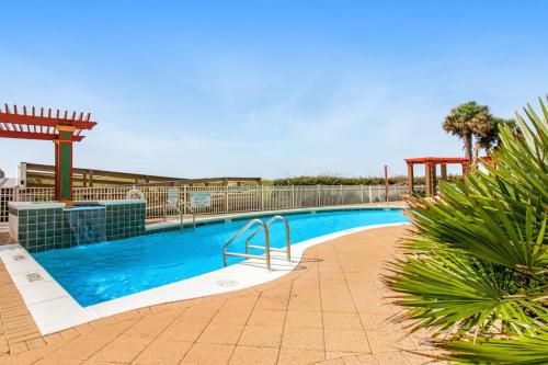 a large swimming pool in a resort with at Spacious Gulf Front Condo with Private WD and Shared Pool in Navarre