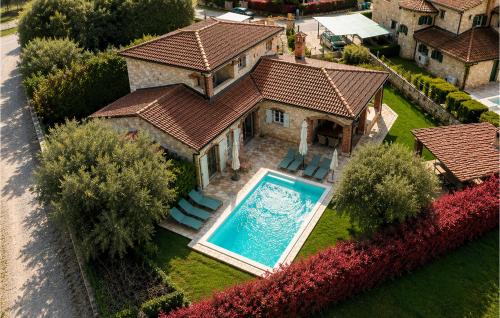 an aerial view of a house with a swimming pool at Villa Novel in Višnjan
