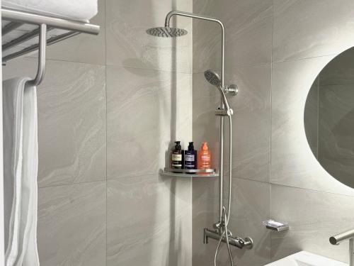 a shower in a bathroom with a glass shower at 담양 다움 스파 빌리지 in Haktong-ni