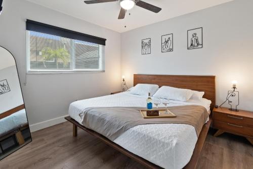 a bedroom with a bed with a tray on it at Stylish Dania Beach Stay Beach, Cruise Port FLL Airport in Dania Beach