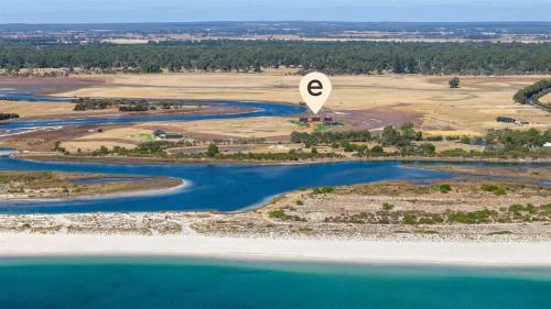 an aerial view of a hot air balloon over a river at Samphire Chalet Tuart - Luxury Amidst Nature in Geographe