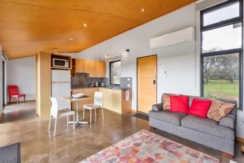 a living room with a couch and a kitchen at Petra Olive 1 in Yallingup
