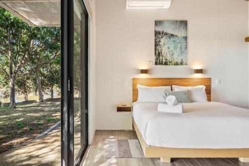a bedroom with two beds and a window at Petra Olive 5 in Yallingup