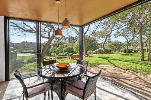 a dining room with a table and chairs at Petra Olive 4 in Yallingup