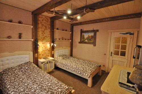 a bedroom with two beds in a room at Dayarta in Skhidnitsa