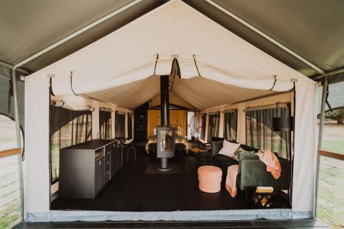 an interior view of a tent with a living room at Wandagar Eco Tent - Baudin in Pemberton