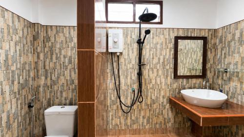 a shower in a bathroom with a toilet and a sink at Zen Harmony Pool Villa in Ko Phangan