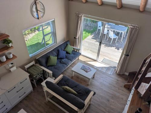 an overhead view of a living room with a couch at Cape St Francis Beach Cottage in Cape St Francis
