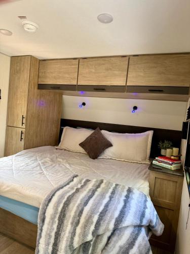 a bedroom with a large bed in a room at Rest Up Retreat-New Lux RV-Private-6Flags-Fire Pit-Hammock-Atlanta in Atlanta