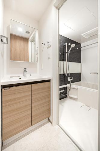 a bathroom with a sink and a shower at Morikoya Hotel in Tokyo