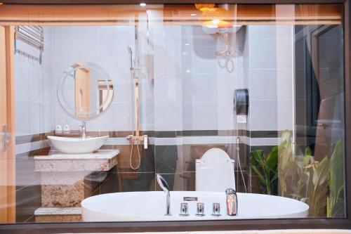 a bathroom with a sink and a mirror at Thong Dong homestay&villas in Ninh Binh