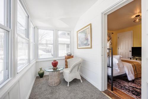 a room with a bed and a table and chairs at Room B3 Shared bathroom queen bed privacy balcony in Rochester