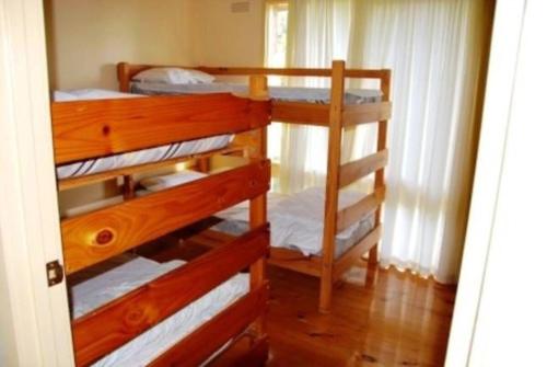 a room with two bunk beds in a room at Seaside Haven in Port Welshpool