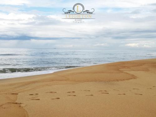 an image of footprints in the sand on the beach at Leighton Resort in Negombo
