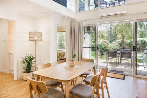 a dining room with a table and chairs at Banksia at Whitesands - Villa 5 Loft-Style Living by the Bay in Dunsborough