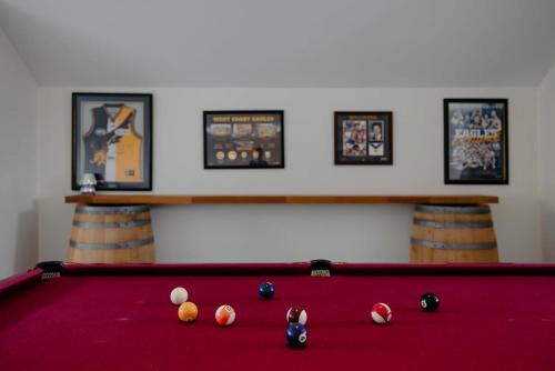 a pool table with balls on top of it at Luxury at the Cove - Seaside Comfort & Entertainment in Quindalup