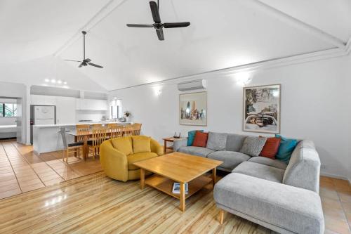a living room with a couch and a table at Blue Haven Townhouse - Beachside Retreat with Pool Access in Gnarabup