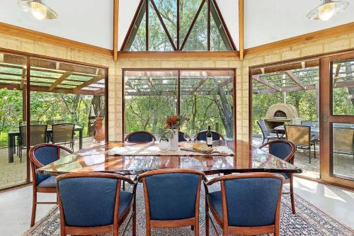 a large dining room with a table and chairs at Eagle Bay Beach Lodge - Escape to Coastal Serenity in Dunsborough