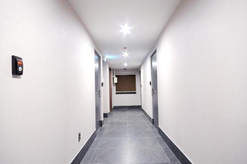 a corridor of an office building with a hallway at Queens Hotel Seomyeon Busan in Busan