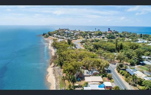 an aerial view of a beach with houses and the ocean at Ocean Breezes with Leafy View with Wi-fi in Slade Point