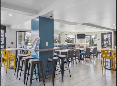 a restaurant with chairs and tables in a room at Days Inn Merced / Yosemite Area in Merced