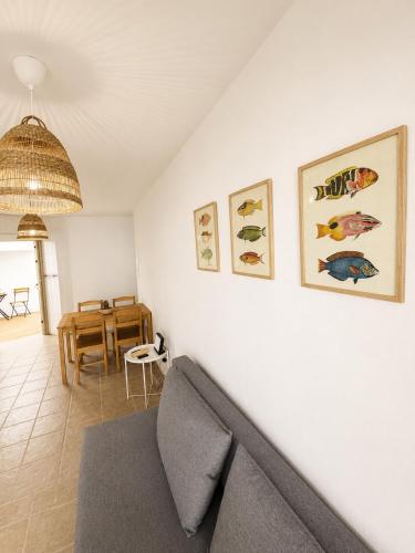 a living room with a couch and a table at El HierroStay Appartments - La Chalana & El Remo in La Restinga