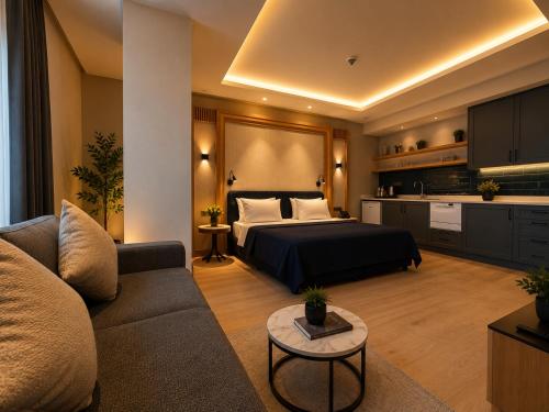 a hotel room with a bed and a couch at Cher Hotel Eyüp in Istanbul