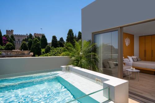 a swimming pool on the roof of a house at The 12th City Hotel in Rhodes Town